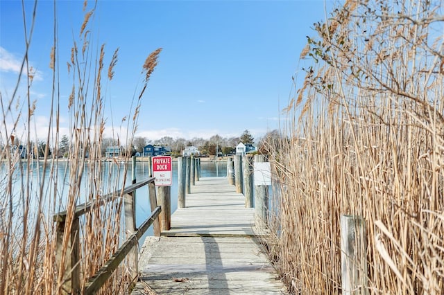 view of dock with a water view