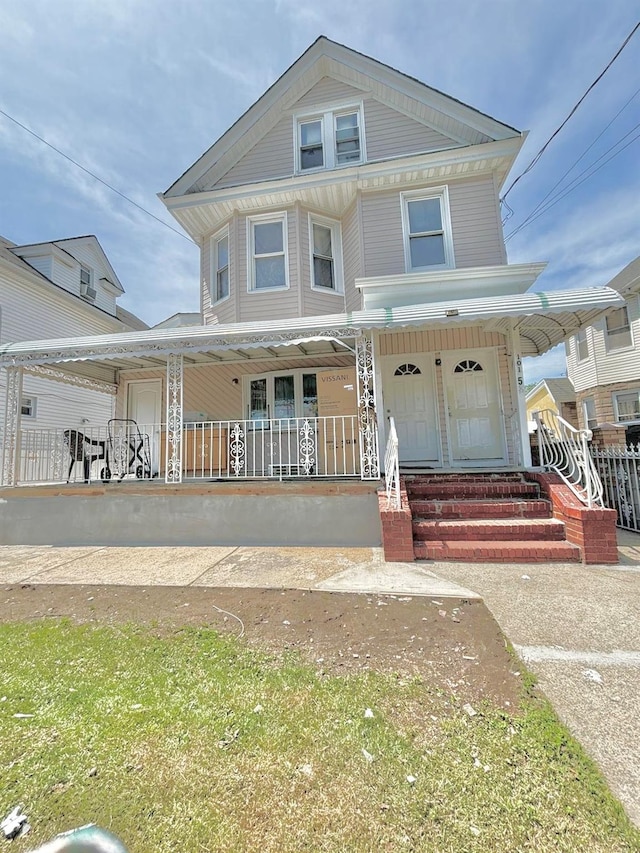 view of front of property featuring covered porch