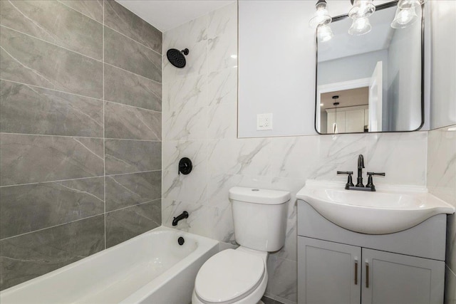 full bathroom with tiled shower / bath, vanity, backsplash, tile walls, and toilet