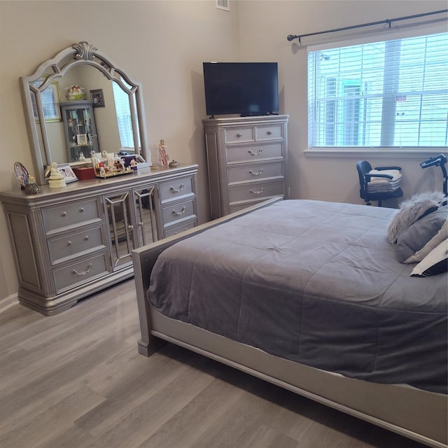 bedroom with light hardwood / wood-style flooring