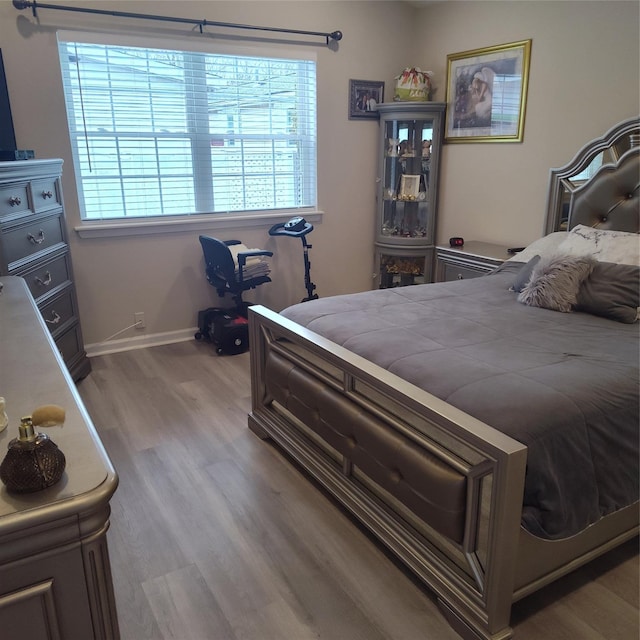 bedroom featuring light wood-type flooring