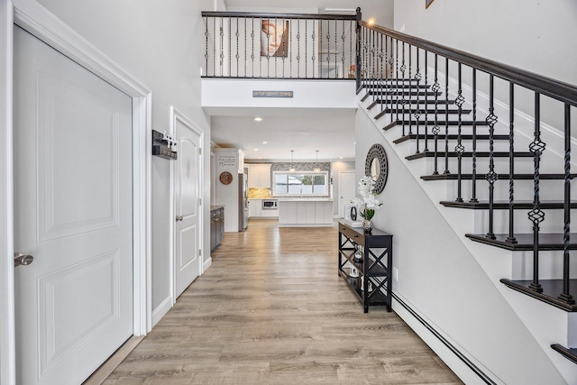 interior space featuring hardwood / wood-style flooring and baseboard heating