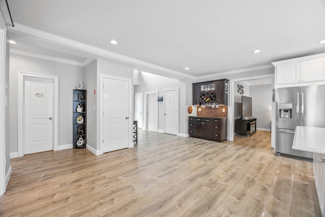 kitchen featuring light hardwood / wood-style floors, stainless steel fridge with ice dispenser, dark brown cabinets, white cabinets, and backsplash