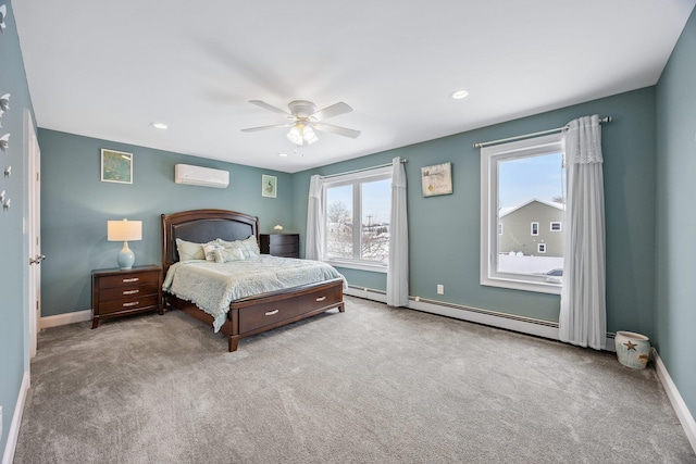 bedroom with ceiling fan, light carpet, and a wall unit AC