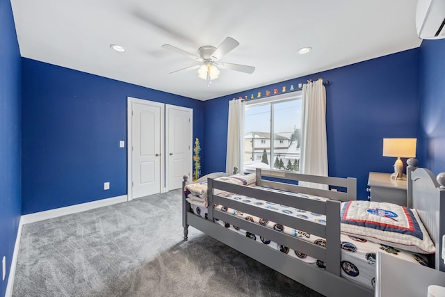 bedroom featuring ceiling fan, carpet, and a wall mounted AC