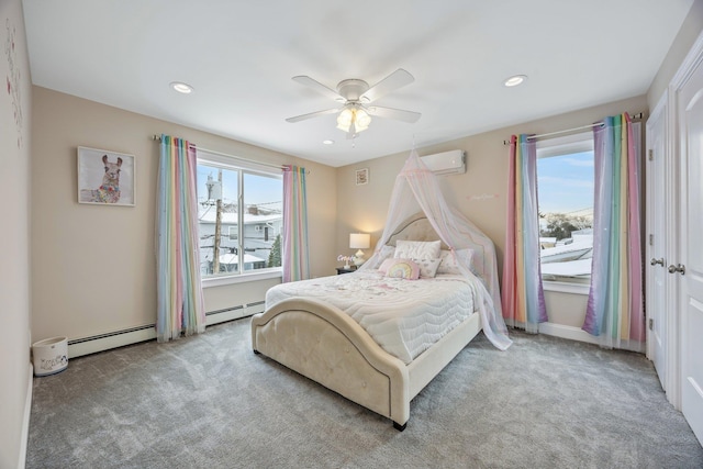 bedroom with ceiling fan, baseboard heating, multiple windows, and light carpet