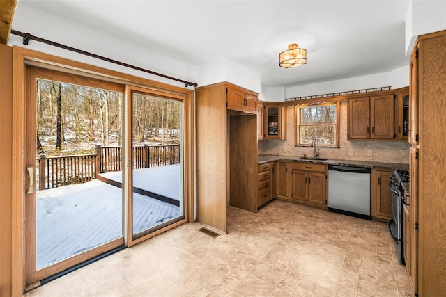 kitchen featuring sink, backsplash, and appliances with stainless steel finishes