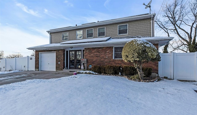 front of property with a garage