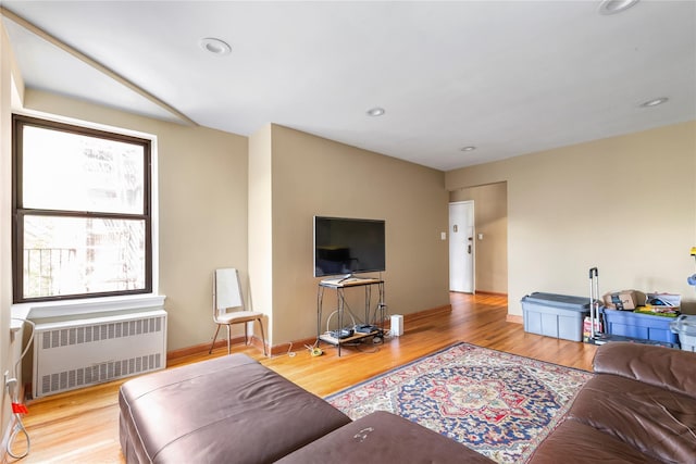 83-15 98th St Unit 6B, Woodhaven, NY 11421 - living area featuring radiator heating unit, wood finished floors, and recessed lighting