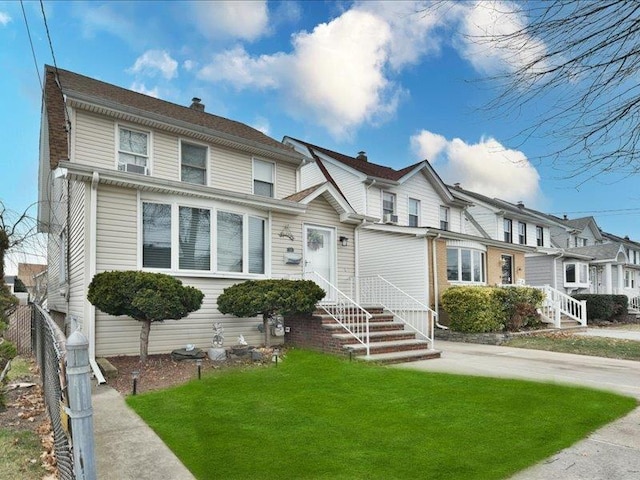 view of front of property with a front lawn