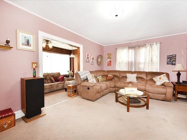 carpeted living room with crown molding and plenty of natural light