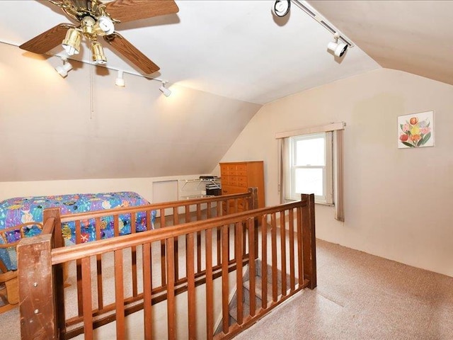 additional living space featuring carpet and lofted ceiling