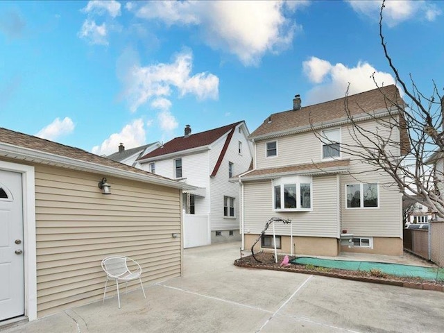 back of property with a patio area