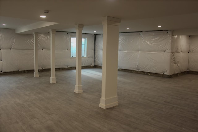 basement with hardwood / wood-style flooring