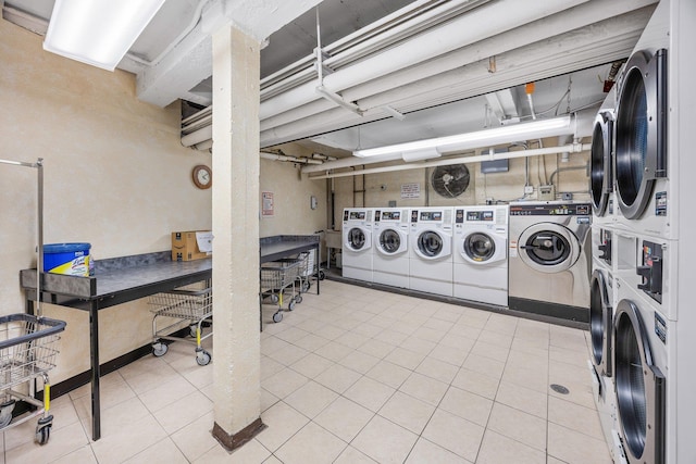 clothes washing area featuring washing machine and clothes dryer and stacked washer and clothes dryer