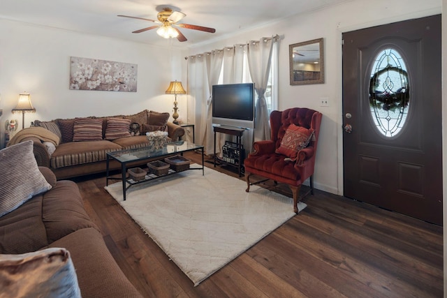 living room featuring ceiling fan and dark hardwood / wood-style floors