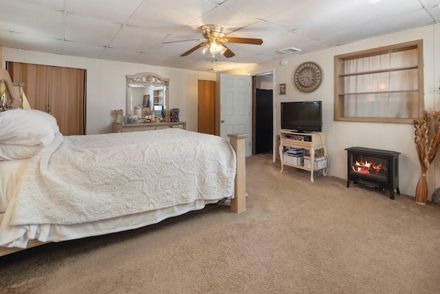 bedroom featuring carpet flooring, a paneled ceiling, and ceiling fan