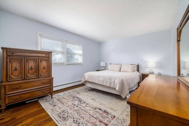 bedroom with a baseboard radiator and dark hardwood / wood-style flooring