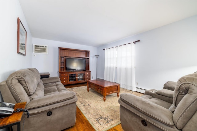 living room with wood-type flooring, a baseboard heating unit, and a wall mounted air conditioner