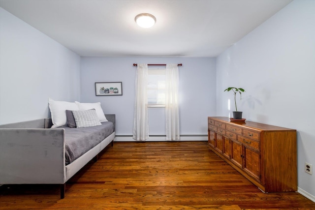 bedroom with dark hardwood / wood-style floors