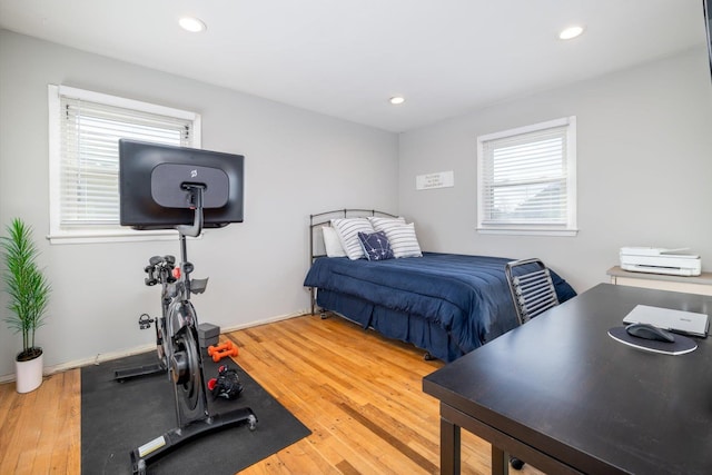 bedroom with hardwood / wood-style floors