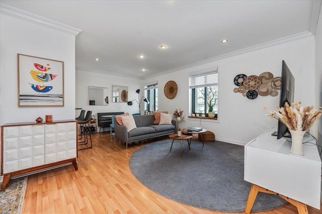 living room featuring hardwood / wood-style flooring and crown molding