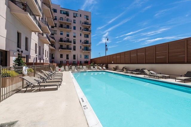 view of swimming pool with a patio area