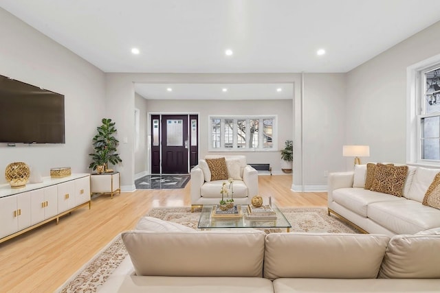 living room with light hardwood / wood-style flooring