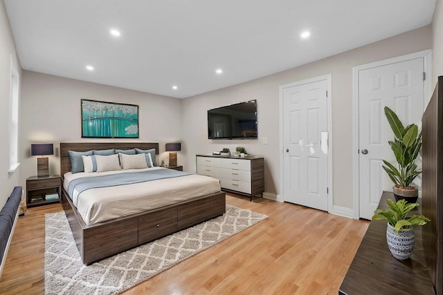 bedroom with light wood-type flooring