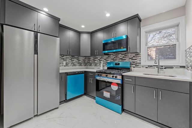 kitchen featuring dishwashing machine, sink, built in refrigerator, backsplash, and stainless steel range with gas stovetop