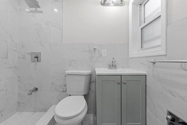 bathroom with vanity, a shower, and toilet