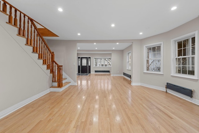 unfurnished living room featuring light wood-type flooring