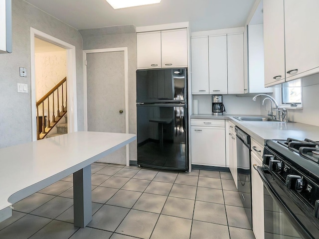 kitchen featuring white cabinets, tile patterned floors, sink, and black appliances