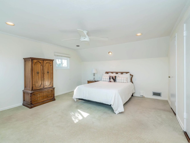 bedroom with lofted ceiling, crown molding, light colored carpet, and ceiling fan