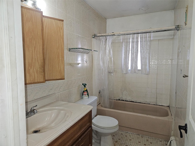 full bathroom with vanity, shower / tub combo, decorative backsplash, tile walls, and toilet