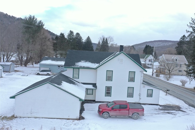 view of front of property with a mountain view