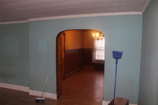 unfurnished room with dark wood-type flooring and ornamental molding