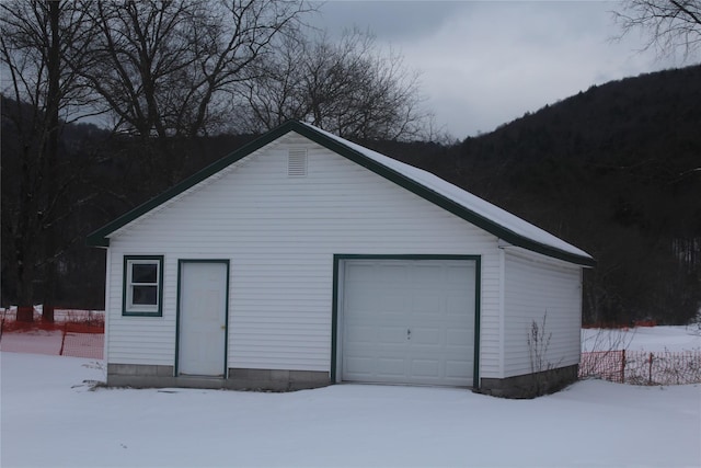 view of snow covered garage