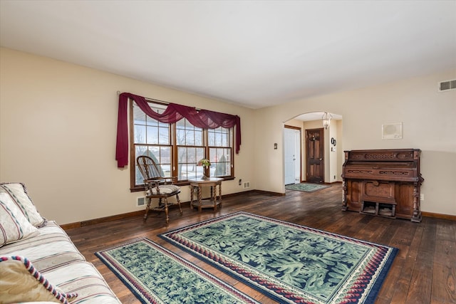 living room with dark hardwood / wood-style floors