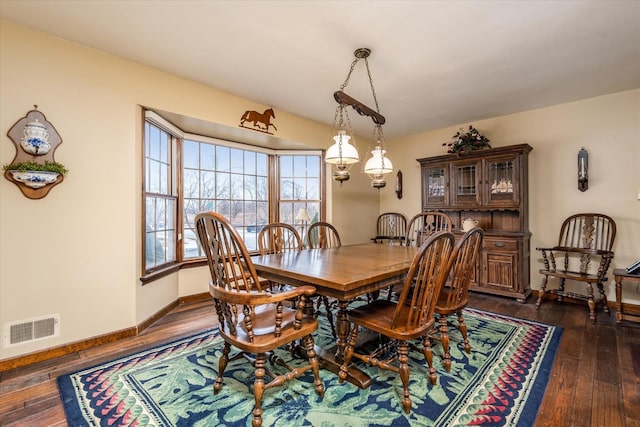 dining area featuring dark hardwood / wood-style flooring