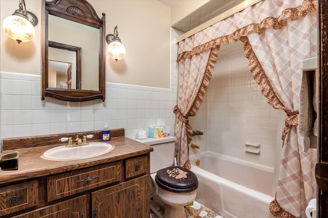 full bathroom featuring tile walls, toilet, vanity, and shower / bathtub combination with curtain