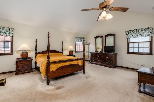 carpeted bedroom featuring ceiling fan and vaulted ceiling