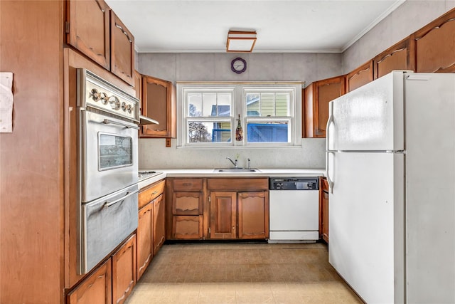 kitchen featuring sink and white appliances