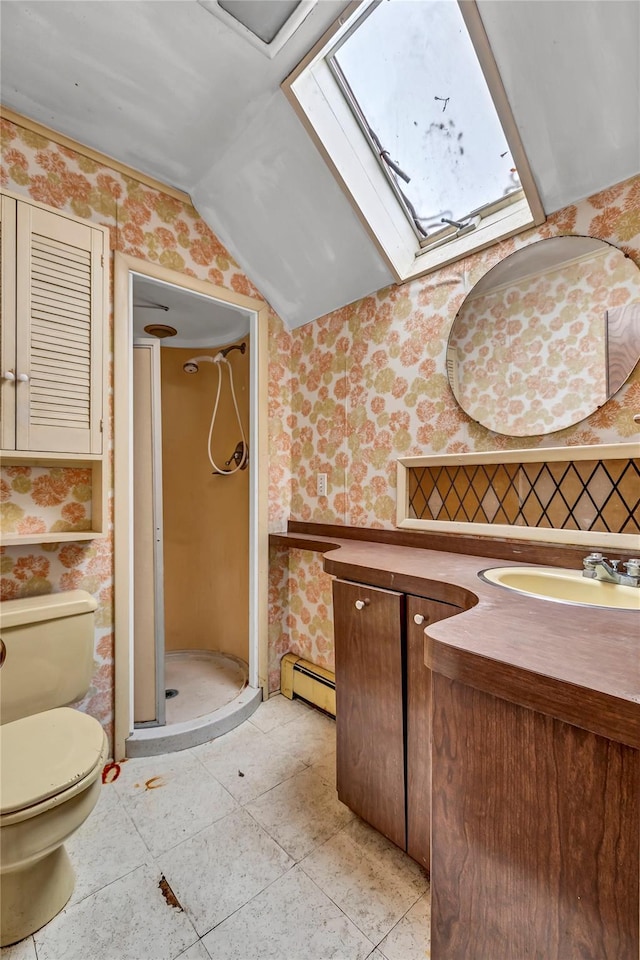 bathroom with a shower, a baseboard heating unit, lofted ceiling with skylight, toilet, and vanity