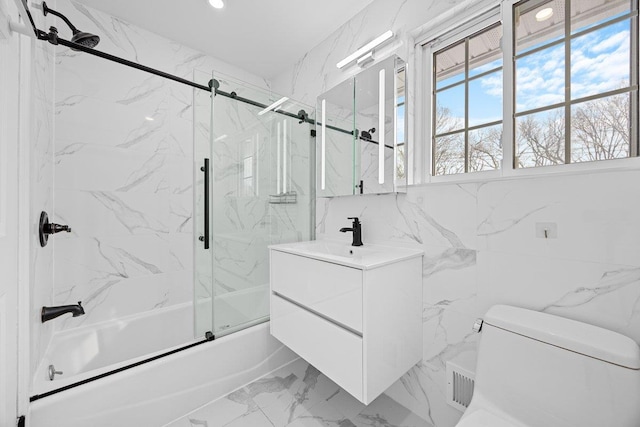 full bathroom featuring enclosed tub / shower combo, vanity, and toilet