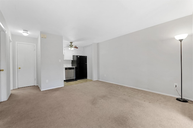 unfurnished living room with ceiling fan and light carpet