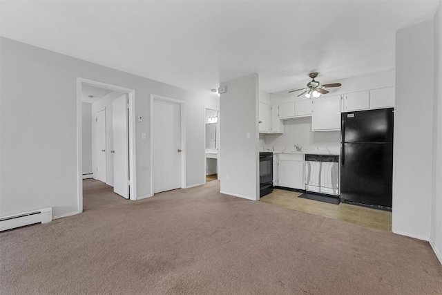 kitchen with black refrigerator, light colored carpet, dishwasher, and white cabinets