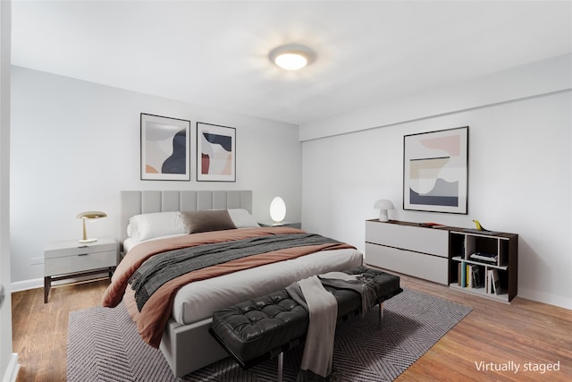 bedroom with light hardwood / wood-style flooring