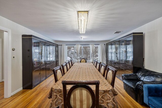 dining space featuring light wood-type flooring