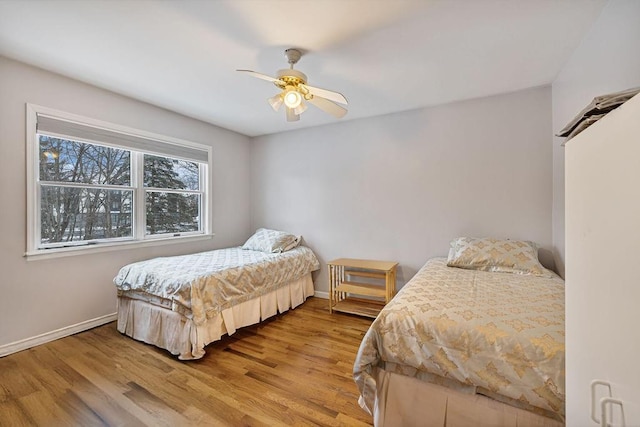 bedroom featuring ceiling fan and light wood-type flooring